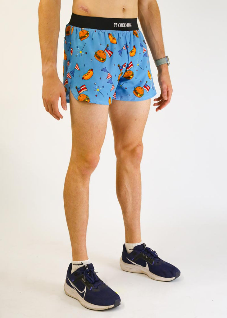 Model wearing chicknlegs men's 4 inch split running shorts in the usa cookout design facing right