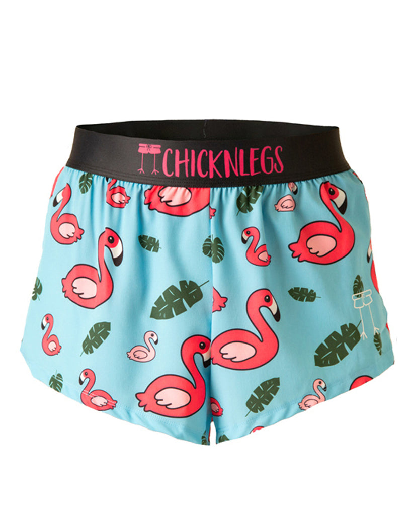 Chicknlegs men's 2 in split running shorts in the blue flamingo design as a ghost image. The print has a light blue background with green leaves and a hot pink flamingo.