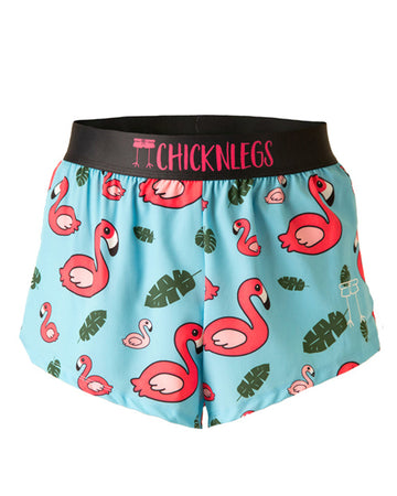 Chicknlegs men's 2 in split running shorts in the blue flamingo design as a ghost image. The print has a light blue background with green leaves and a hot pink flamingo.