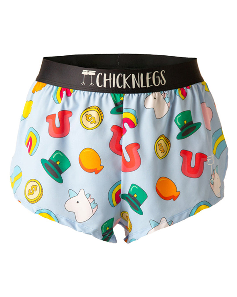 These Chicknlegs shorts are the men's 2 in split running shorts in the charms design, as a ghost image. The print has an orange balloon, a unicorn on it, money coins, a green hat, a rainbow and a red U on it as a horseshoe. 