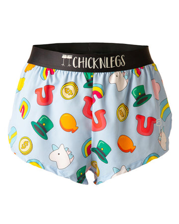 These Chicknlegs shorts are the men's 2 in split running shorts in the charms design, as a ghost image. The print has an orange balloon, a unicorn on it, money coins, a green hat, a rainbow and a red U on it as a horseshoe. 