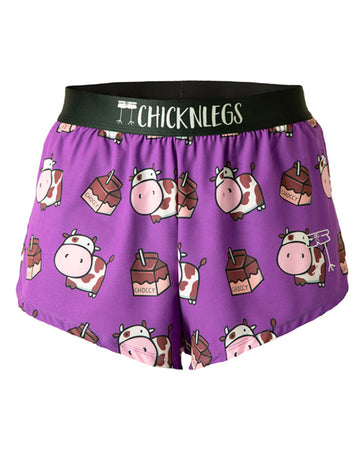 These chicknlegs shorts are the men's 2 in split running shorts in the choccy cow design, as a ghost image. The print has brown cows on it with chocolate milk on it and a purple background.