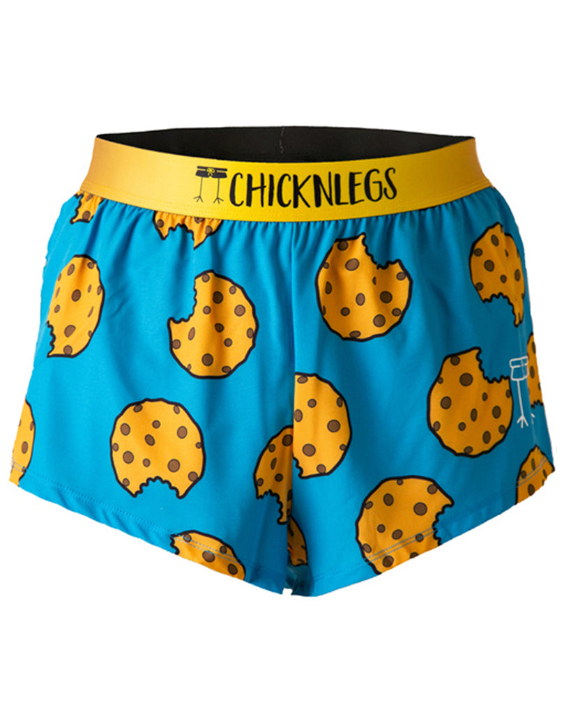 These chicknlegs are in the men's 2 in split running shorts in the cookies design, as a ghost image. The print has cookies on it on a blue background and yellow waistband.