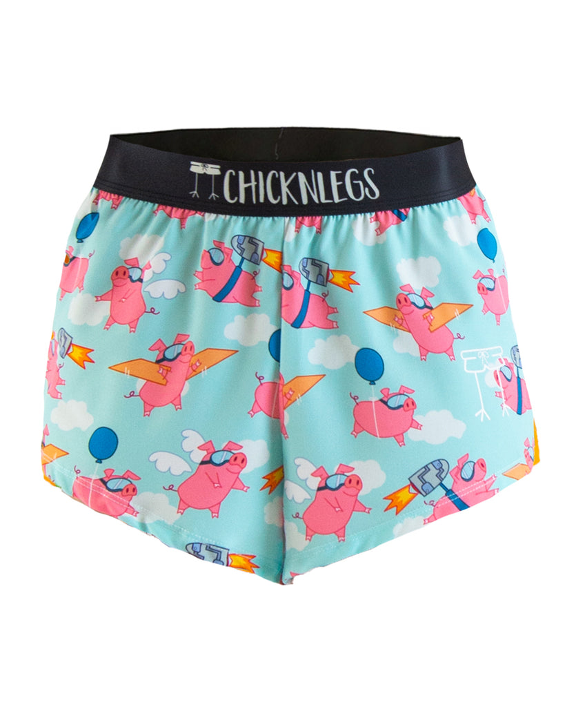 Ghost Image of ChicknLegs men's 2 in split running shorts in the flying pigs design. The print has pink pigs that are flying through the blue sky.