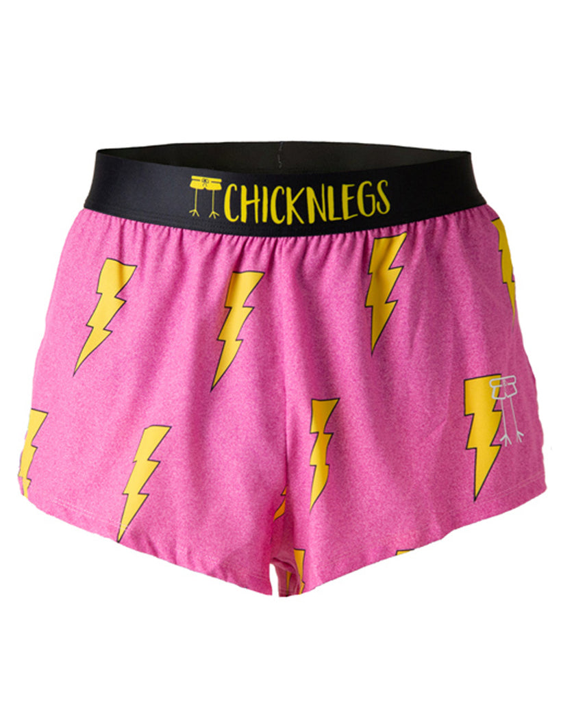 These shorts are from Chciknlegs as the men's 2 in split running shorts that have the hot pink bolts on them, as a ghost image. The print has yellow bolts on it with a hot neon pink background with a black waistband.