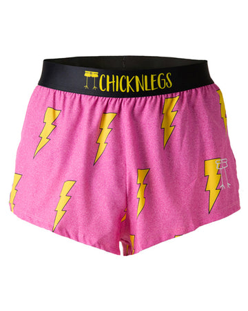 These shorts are from Chciknlegs as the men's 2 in split running shorts that have the hot pink bolts on them, as a ghost image. The print has yellow bolts on it with a hot neon pink background with a black waistband.