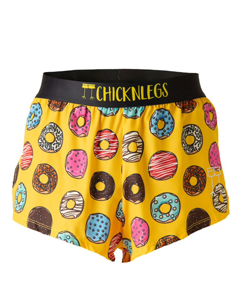 These shorts are from Chicknlegs in the men's 2 in split running shorts as the salty donut design, as a ghost image. These shorts are made for runners who love donuts in various flavors and forms. Bright yellow background with a ton of doughnuts.