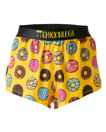 These shorts are from Chicknlegs in the men's 2 in split running shorts as the salty donut design, as a ghost image. These shorts are made for runners who love donuts in various flavors and forms. Bright yellow background with a ton of doughnuts.