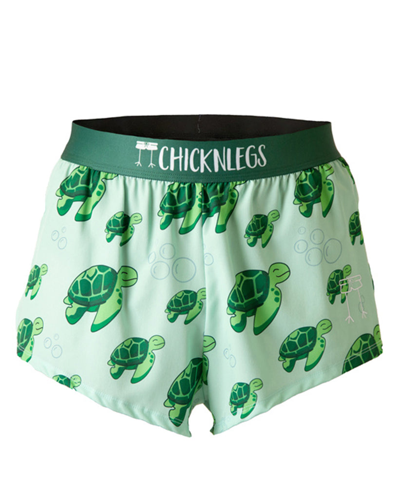 These shorts are from Chicknlegs in the men's 2 in split running shorts n the turtle design, as a ghost image. These shorts have sea turtles all over them with bubbles on a light green background. Lot of green.