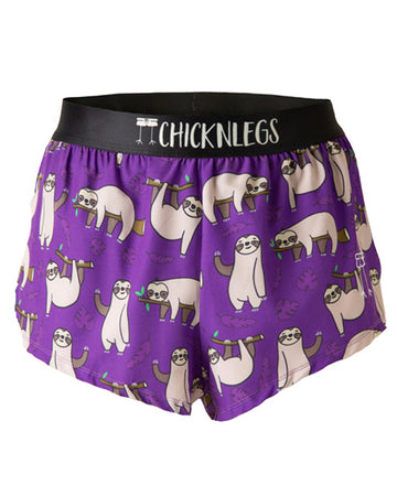 These shorts are from Chicknlegs in the men's 2 in split running shorts in the sloths, as the ghost image. This design has sloths all over them sitting and sleeping, laying on branches and waving. It is on a purple background with leaves.