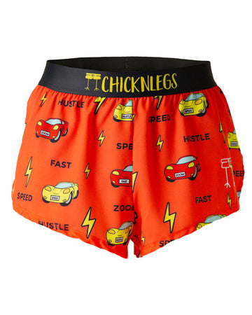 These Chicknleg's shorts are in the men's 2 in split running shorts in the cars design, as a ghost image. The print has yellow bolts on it with red and yellow cars all over, with text as speed, fast, hustle, and zoom.