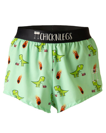 Ghost image is from ChicknLegs in the men's 2 in split running shorts in the dino-sore design. The print has green dinosaurs on it with meteors and popcorn.