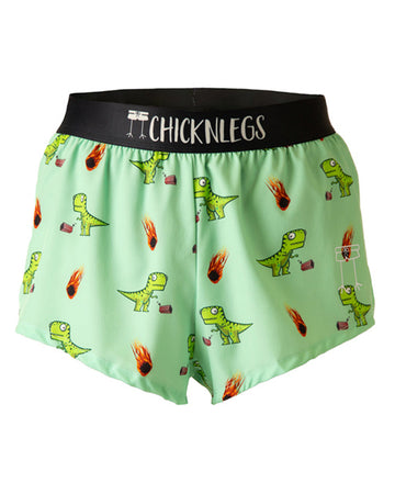 Ghost image is from ChicknLegs in the men's 2 in split running shorts in the dino-sore design. The print has green dinosaurs on it with meteors and popcorn.