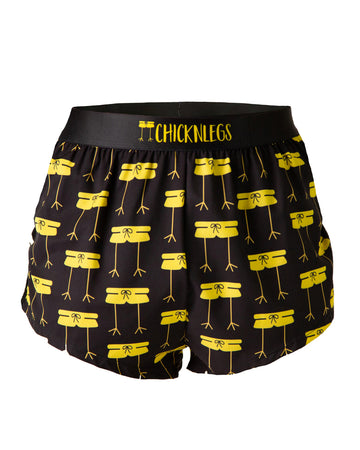 Ghost image is of ChicknLegs men's 2 in split running shorts in the midnight mile design. The print has the ChicknLegs logo all over it in bright yellow with a black background.