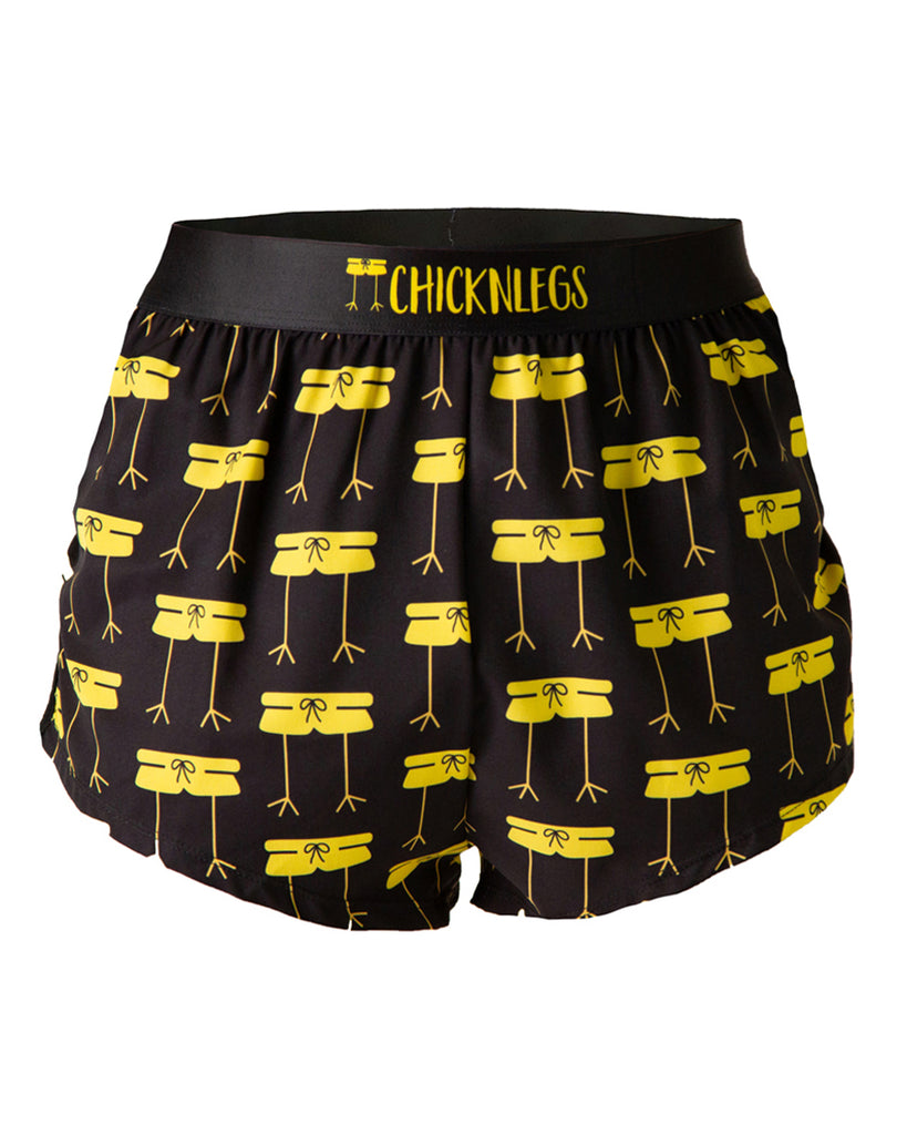 Ghost image is of ChicknLegs men's 2 in split running shorts in the midnight mile design. The print has the ChicknLegs logo all over it in bright yellow with a black background.