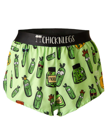 These shorts are from chicknlegs as the men's 2 in split running shorts as the pickles design, as a ghost image. They have pickles all over them in different shapes and sizes in a green jar and a yellow jar.