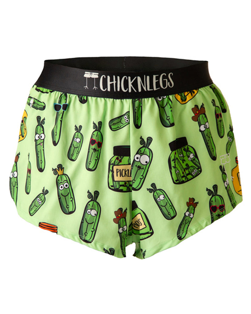 These shorts are from chicknlegs as the men's 2 in split running shorts as the pickles design, as a ghost image. They have pickles all over them in different shapes and sizes in a green jar and a yellow jar.