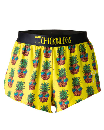 These shorts are from Chicknlegs in the men's 2 in split running shorts as the pineapple express design, as a ghost image. The shorts are made for runners that have fun bright pineapples with sunglasses on a yellow background.