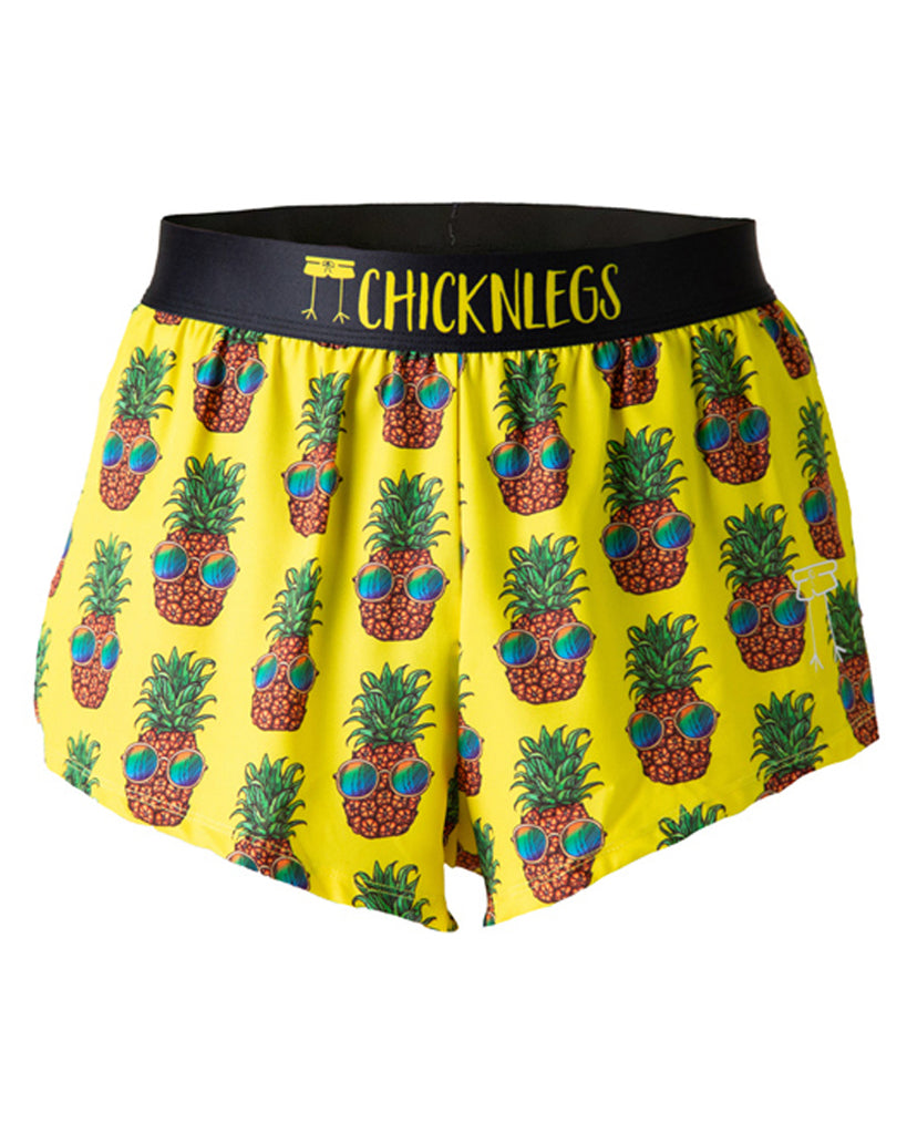 These shorts are from Chicknlegs in the men's 2 in split running shorts as the pineapple express design, as a ghost image. The shorts are made for runners that have fun bright pineapples with sunglasses on a yellow background.