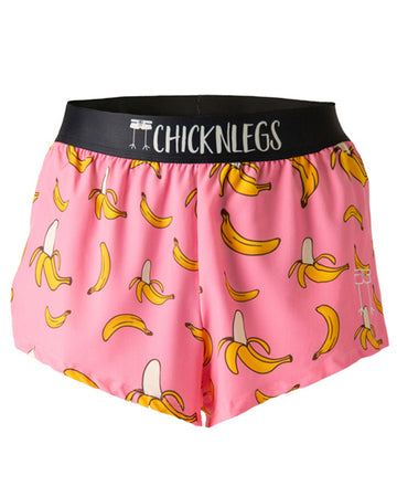 These shorts are from Chicknegs from the men's 2 in split running shorts in the pink banana design, as a ghost image. These shorts have bananas all over them with a pink background.