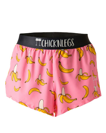 These shorts are from Chicknegs from the men's 2 in split running shorts in the pink banana design, as a ghost image. These shorts have bananas all over them with a pink background.