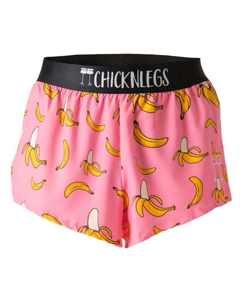 These shorts are from Chicknegs from the men's 2 in split running shorts in the pink banana design, as a ghost image. These shorts have bananas all over them with a pink background.