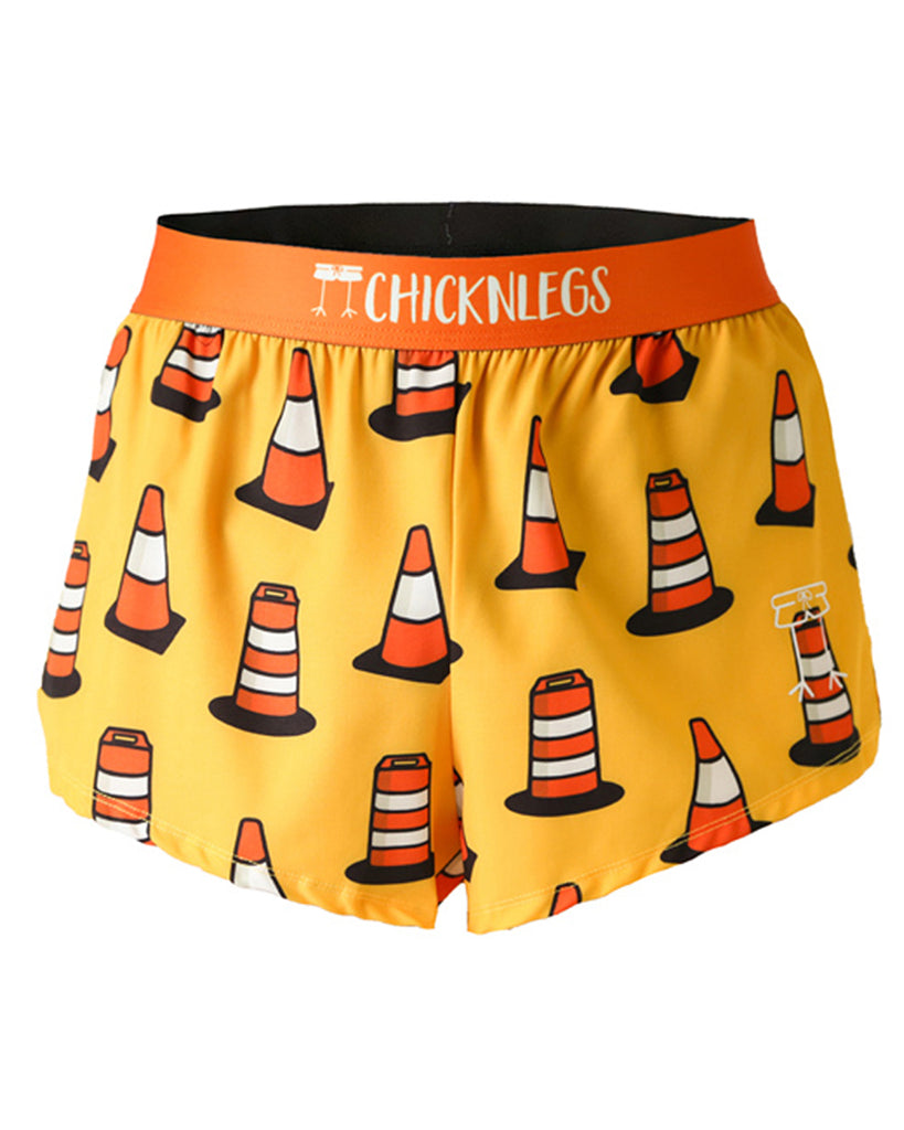 These shorts are from Chicknlegs as the men's 2 in split running shorts as the traffic cones design, as an ghost image. These shorts have traffic cones all over them with a light orange yellow background.