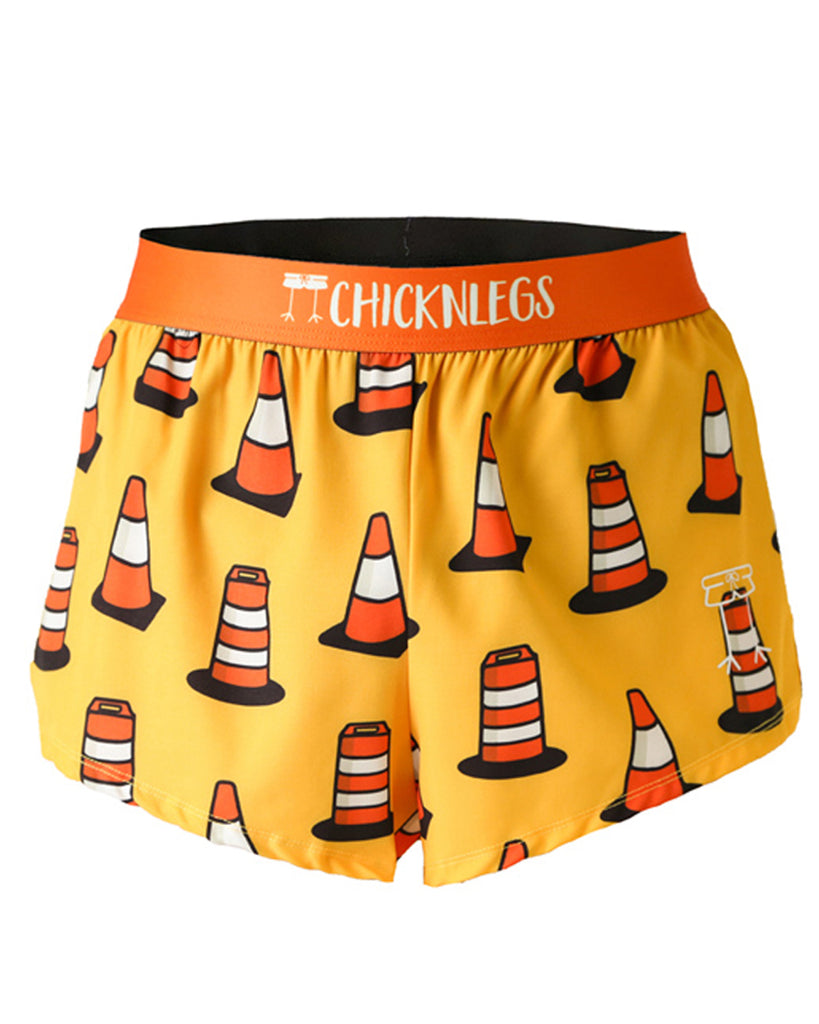 These shorts are from Chicknlegs as the men's 2 in split running shorts as the traffic cones design, as an ghost image. These shorts have traffic cones all over them with a light orange yellow background.