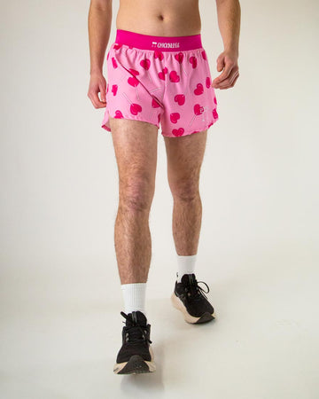 The model is a runner who is wearing Chicknlegs in the men's 4" in split running shorts in the LuvPops design, facing front.