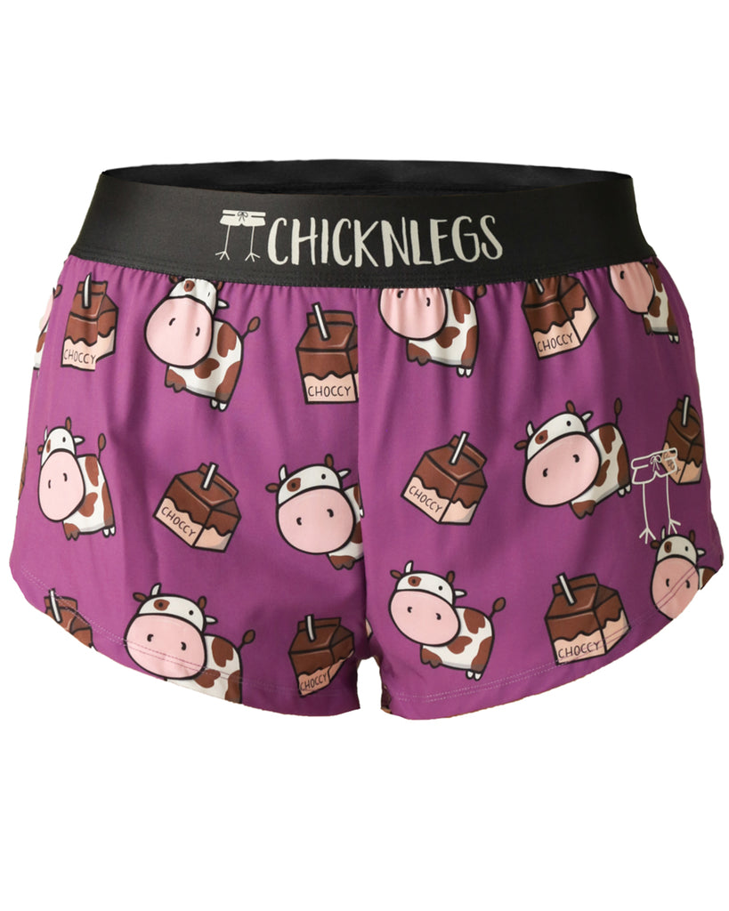 These shorts are from Chicknlegs in the women's 1.5 in split running shorts as the choccy cow design, as a ghost image. The print has brown cows on it with chocolate milk all over it.