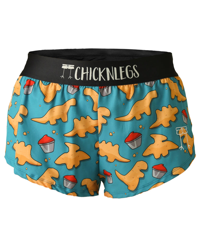 These shorts are from Chicknlegs in the women's 1.5 in split running shorts in the dino nugget design, as a ghost image. The print has dinosaur chicken nuggets and ketchup on it.