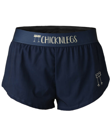 Chicknlegs women's 1.5 in split running shorts in the solid navy design, as a ghost image.