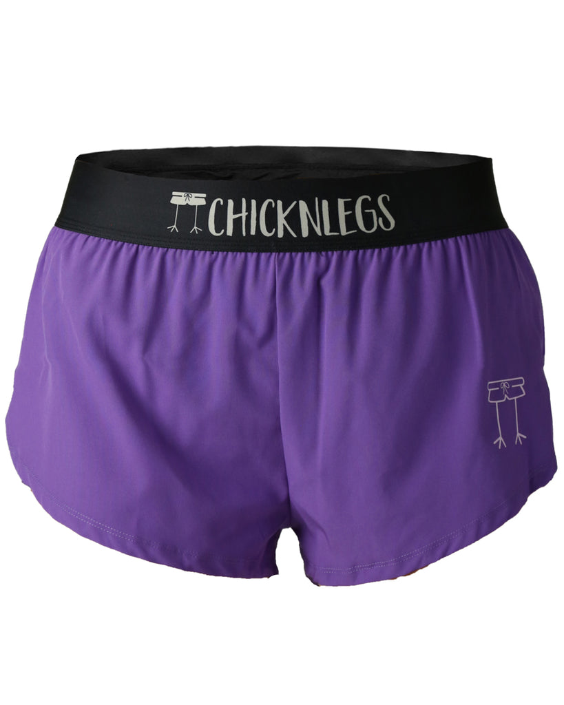 Chicknlegs women's 1.5 in split running shorts in the purple design, as a ghost image. The print is a solid color for runners as purple.