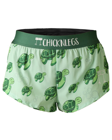 Chicknlegs women's 1.5 in split running shorts in the sea turtle design, as a ghost image. The print has turtles all over it in green on a light green background. Perfect for the beach and for runners.