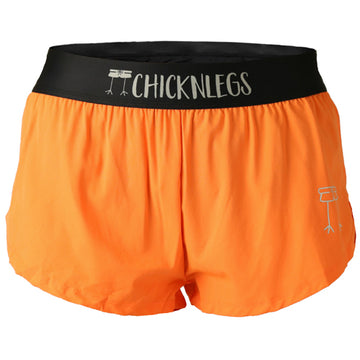 Closeup product shot of the women's neon orange 1.5 inch split running shorts from ChicknLegs.