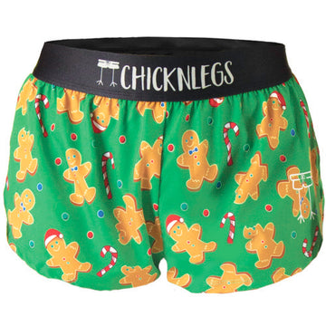 A ghost image is shown of Chicknlegs women's 1.5" split running shorts in the Gingerbread Men Gingy's Revenge design.