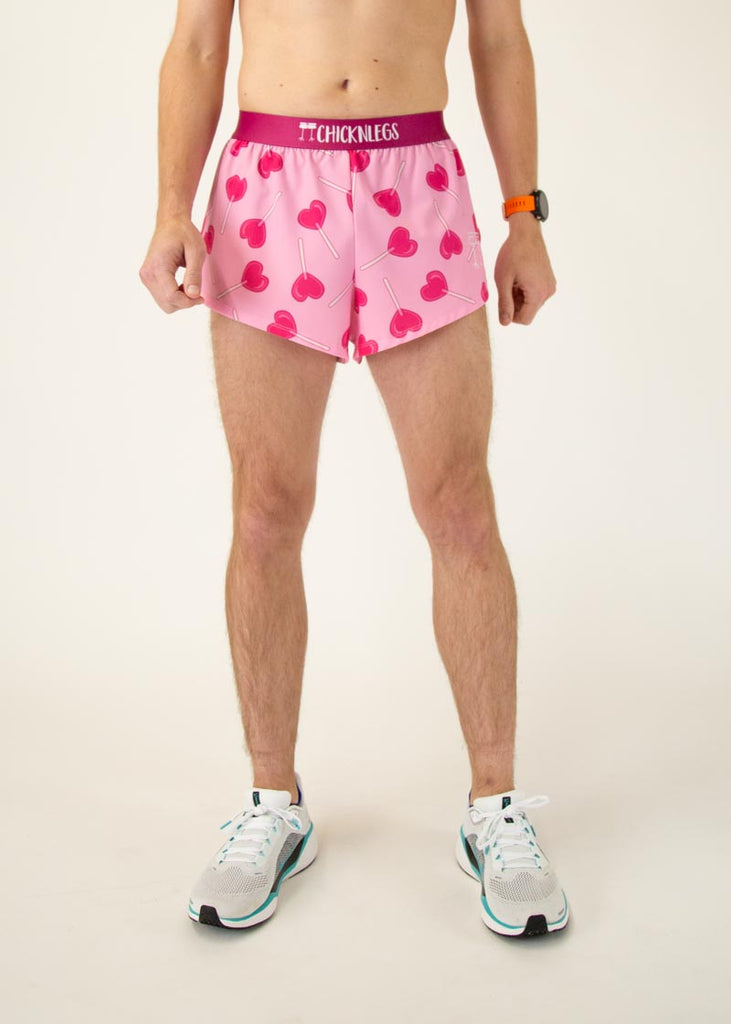 The model is a runner who is wearing Chicknlegs men's 2" in split running shorts in the LuvPops design, facing front.