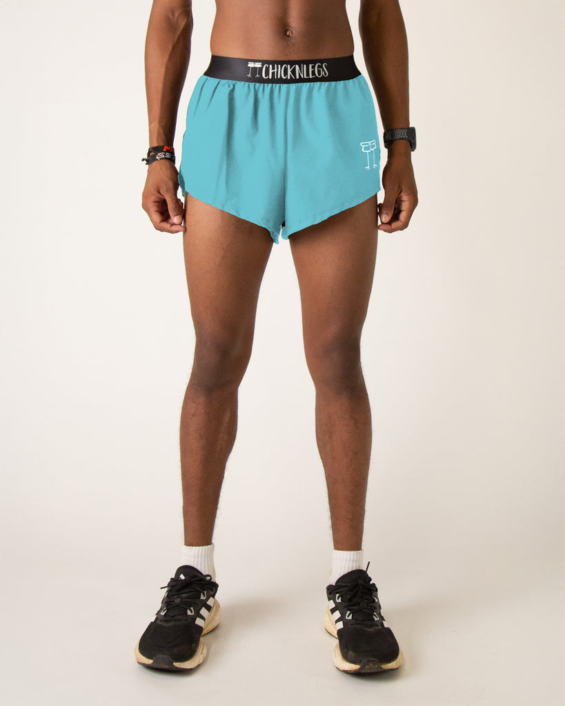 Runner is wearing ChicknLegs in the men's 2 in split running shorts in the sky blue design that matches with the blue flamingo.