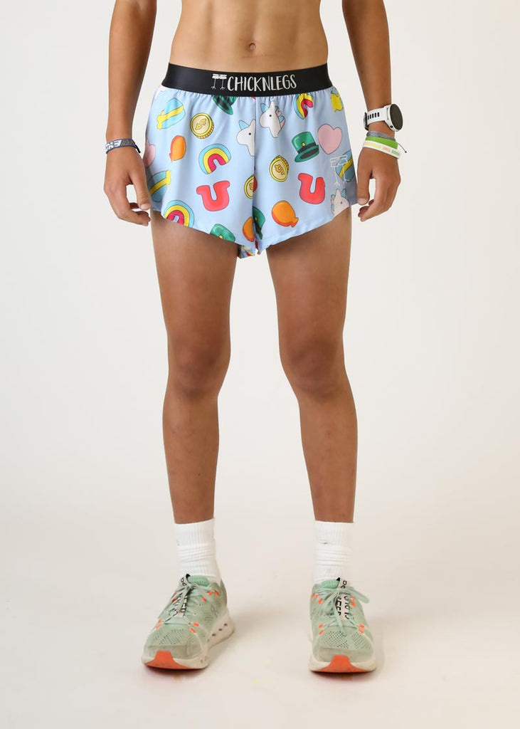 Model wearing mens 2 inch split running shorts in charms design front view