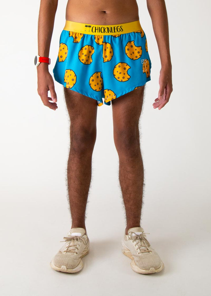 The model is a runner who is wering Chicknlegs in men's 2 inch split running shorts in the cookies design, facing front.