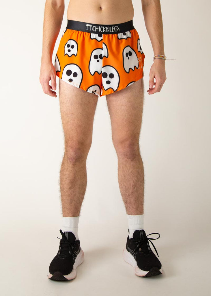 Model is a runner wearing Chicknlegs men's 2 inch split running shorts in the Ghost design, facing front.