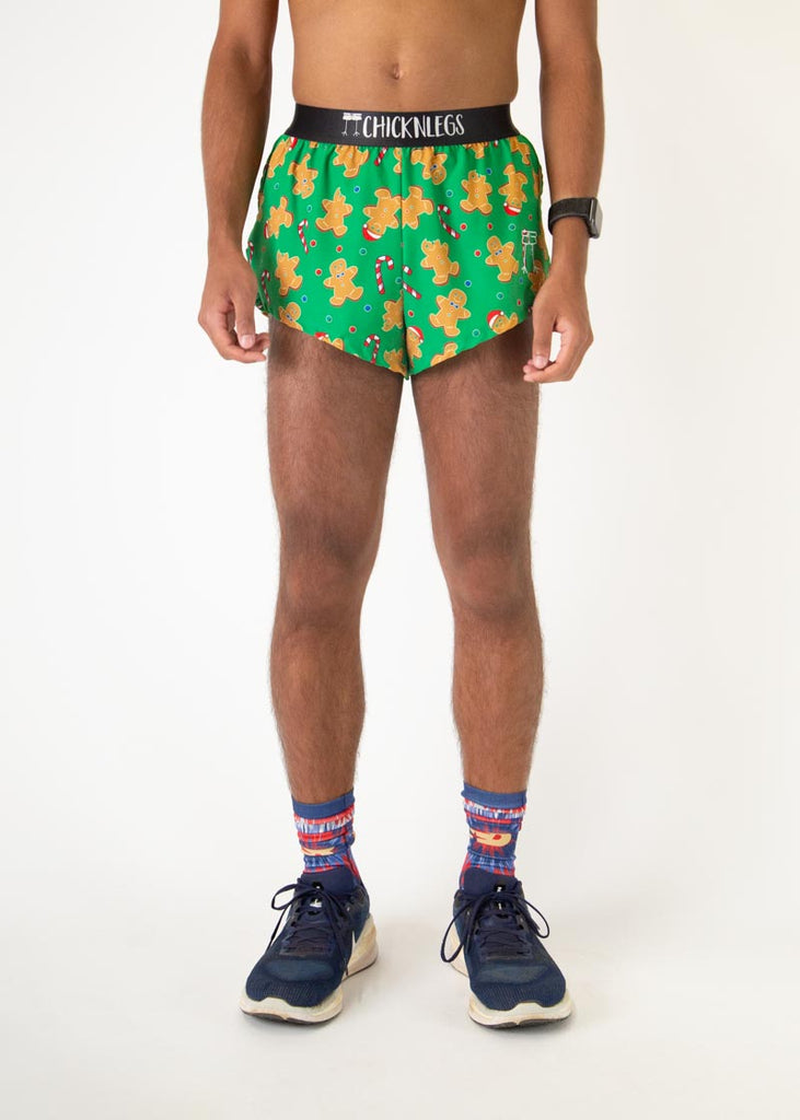 The model is a runner who is wearing Chicknlegs men's 2 inch split running shorts in the Gingerbread Men's Gingy Revenge design, facing front.