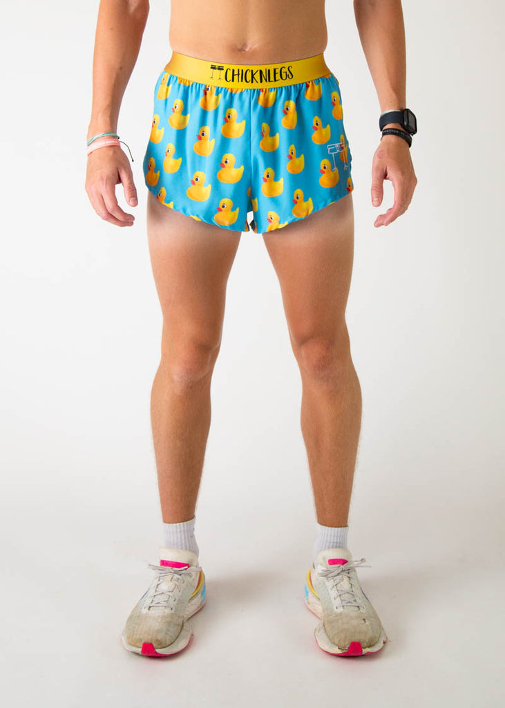 The model is a runner wearing Chicknleg's men's 2 inch split running shorts in the rubber ducky design, facing front.
