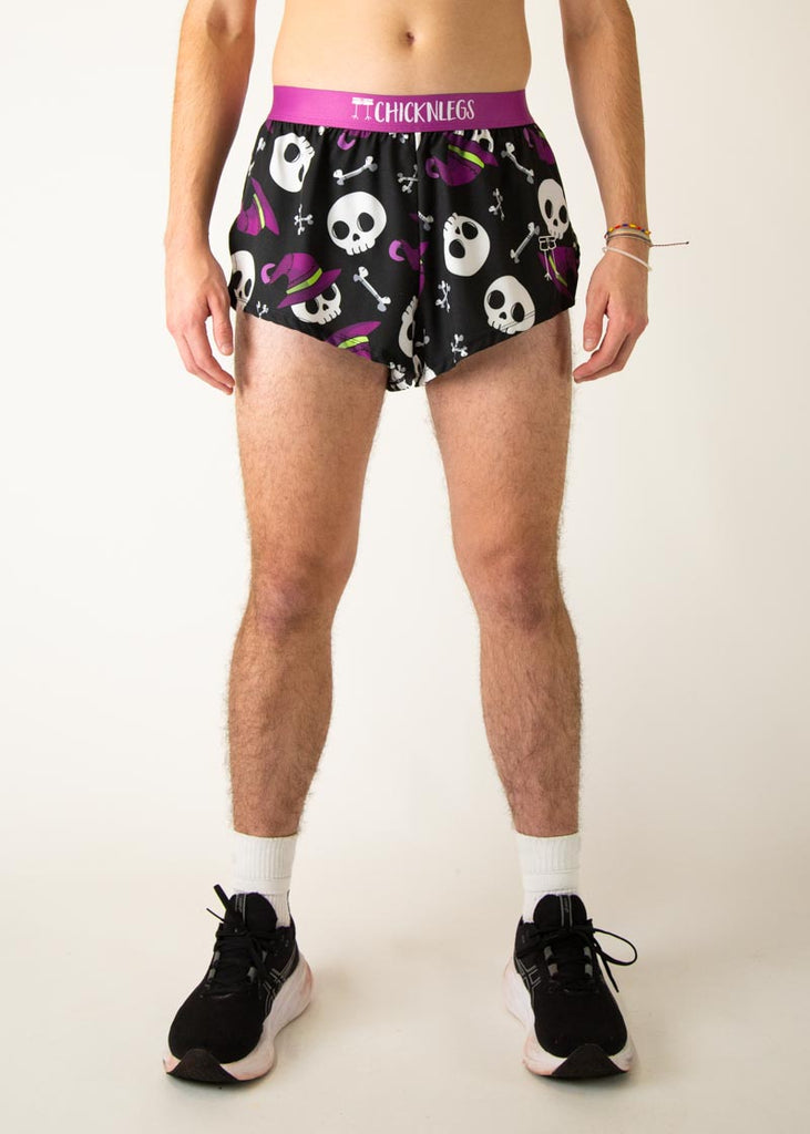 Model is a runner wearing Chicknlegs men's 2 inch split running shorts in the Skulls design, facing front.