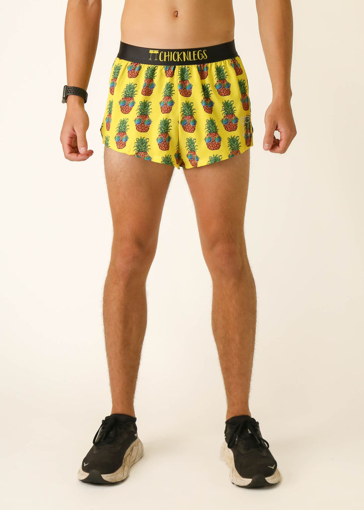 Model wearing Chicknlegs men's 2 inch split running shorts wearing the pineapple express design facing front.
