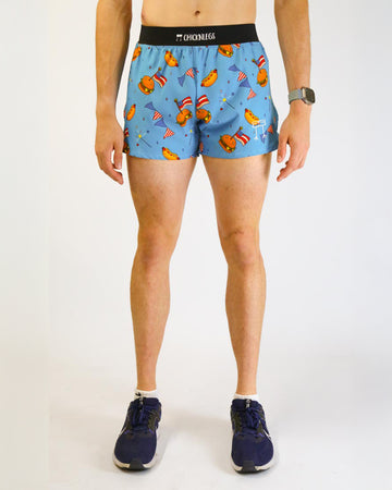 Runner is wearing ChicknLegs in the men's 4 in split running short with back pockets and inner liner pockets. The print has USA american theme foods such as burgers, hot dogs, flags and sparklers. Great for runners who love America.