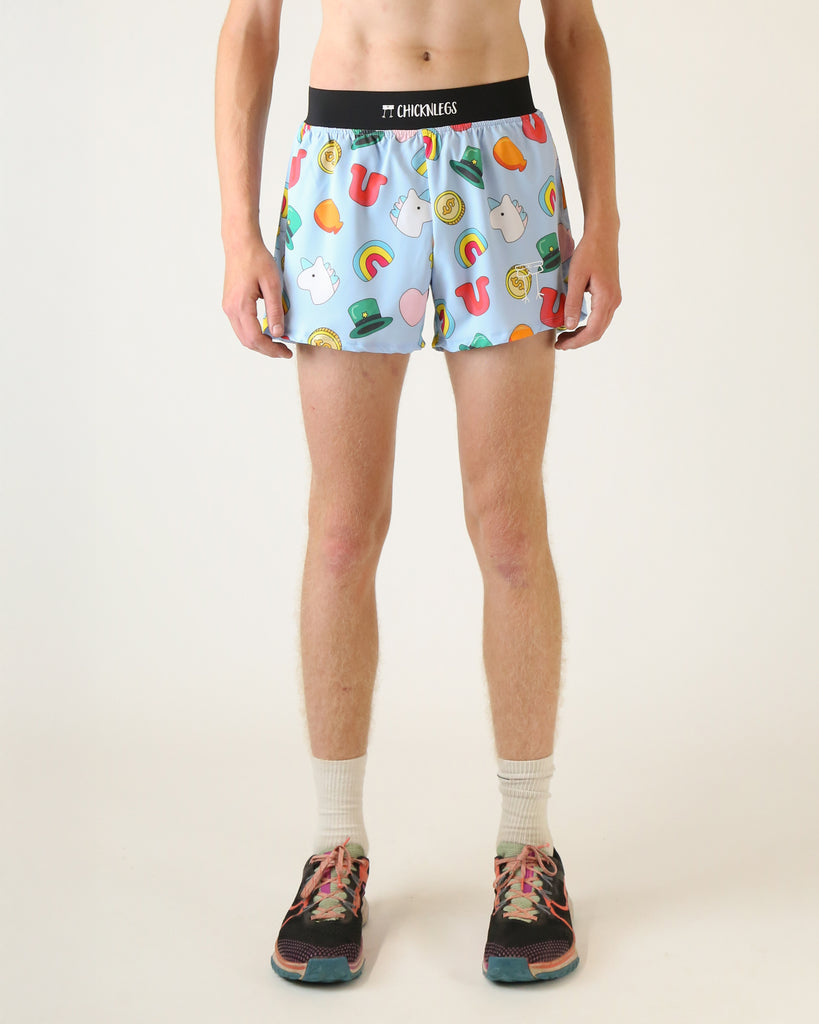 Runner is wearing ChicknLegs in the men's 4 in split running shorts that have a back pocket and inner liner pocket. The print has unicorns, balloons, rainbows, hearts, money, hats, all over it on a light blue background.