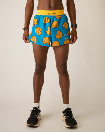 Runner is wearing ChicknLegs in the men's 4 in split running shorts that has a back pocket and inner liner pocket. The print has chocolate chip cookies on it with a blue background.