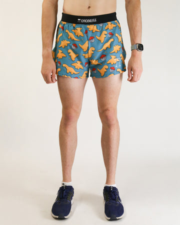 Runner is wearing ChicknLegs in the men's 4 in split running shorts with a back pocket and inner liner pocket. The print has chicken dinosaur nugget nuggets on it with ketchup.