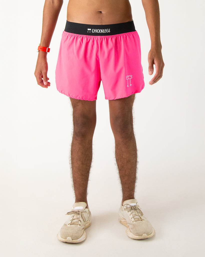 Runner is wearing ChicknLegs in the men's 4 in split running shorts with a back pocket and inner liner pocket. The print is solid neon pink. Great for holidays such as valentines day for the color.